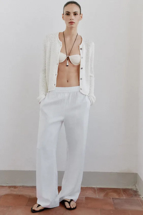 Round neck cardigan with long sleeves and front button fastening. | Zara UK