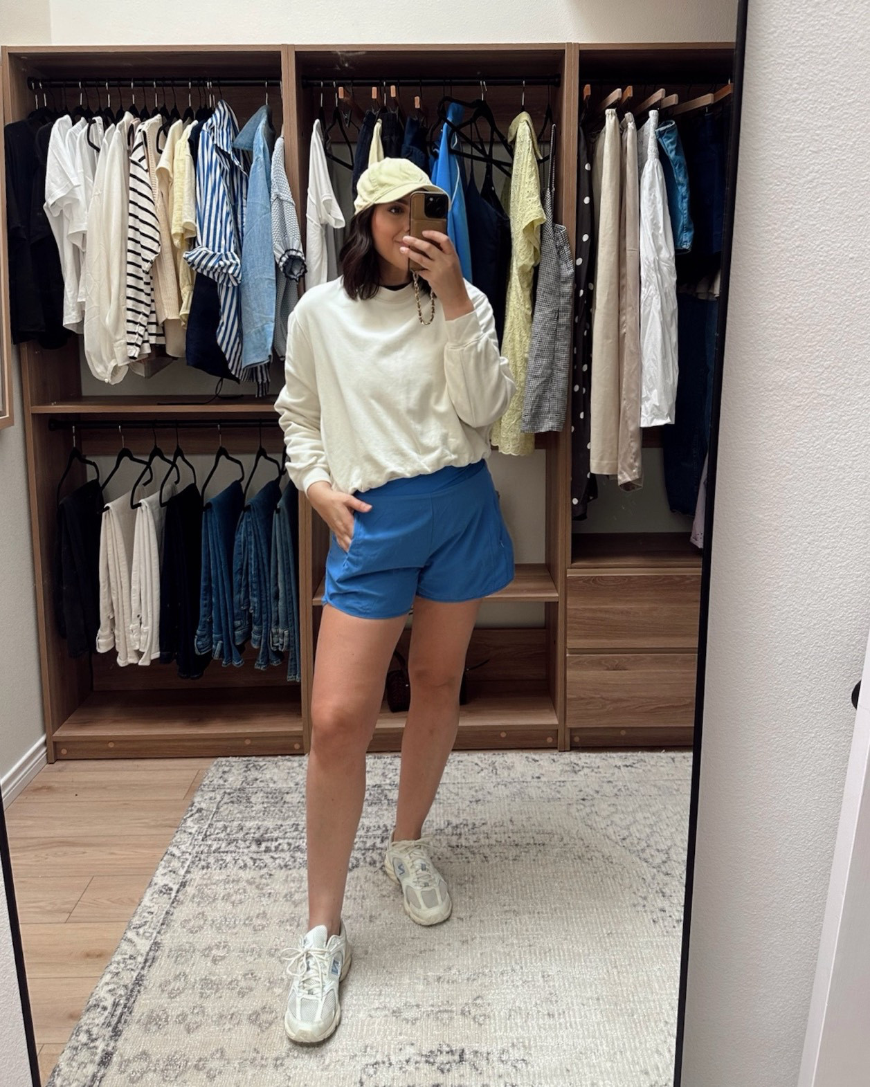 These are the same shorts and they are my absolute favorites right now. I needed some shorts that fit so I bought these in this blue and black and ended up ordering the navy too. I wear them all the time. They’re flattering and they dont’ cut in or ride up. The waistband is a soft stretchy fabric with a v waistline crossover band. I got the large and they’re a perfect fit.

I'm int he medium of the sweatshirt. 

I'm in the large of the tee.  

 