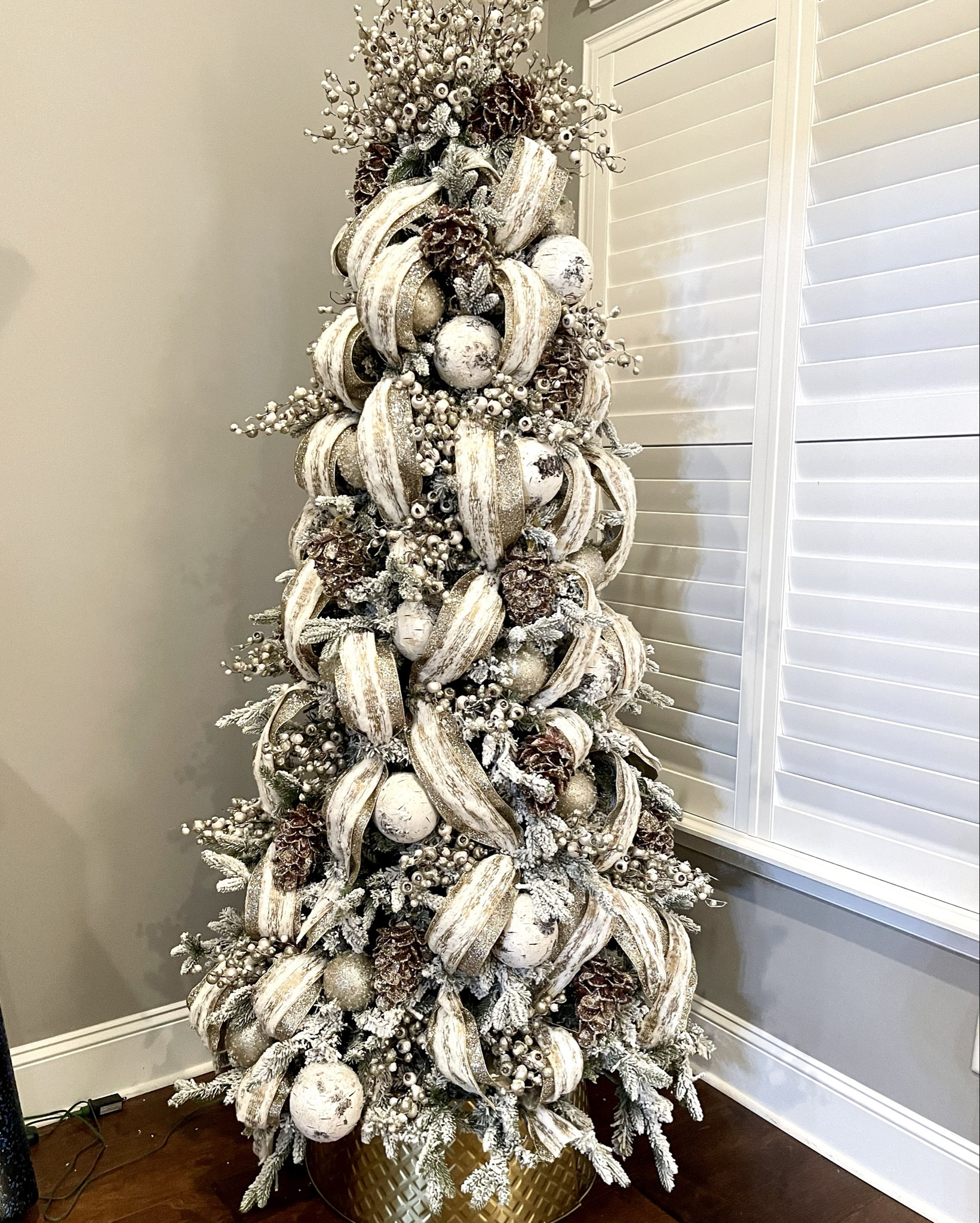 I have 4 King of Christmas trees and the Queen has always been my favorite. 

This is the 8’ Queen Slim Flocked tree. There’s so much to love about this tree.  Here’s my thoughts: 

Flocking: Flocking means it looks like snow on the branches. Quality flocking is important because it can make a big mess. The flocking on King of Christmas trees looks like fallen snow and it stays put! No mess!
 
* Number of tips:  This tree has 2455 tips.  That’s a lot of tips! This is the number of branch tips.  If you buy a tree with a low number of tips the tree will look bare.  You really don’t want to see the pole of the tree.
 
* Warm white LED Lights:  Lighting is important.  LED lights use less energy than traditional incandescent lights..  And sometimes the lights look like the don’t belong on the tree. This tree has 1000 lights. 
 
* Type of Tips. Tips can be realistic or classic.  Classic have a wire in them that is bendable and they are usually in the back of the tree.  I use these as a wire to hold on ribbon.  Classic branches are great, but they don’t look real.  In my opinion, buy a tree with them in the back of the tree, but the front branches should be realistic.   This one is special because the tips have 3 points. That’s what I love the most. It looks more organic and realistic. 
 
* Power Pole: This is the best invention!  The tree comes in 3 parts and the electrical component is in the middle of the tree.  No more finding cables and connecting at every level! Genius

If you are in the market for a tree please reach out to me. I’m happy to help you choose the right tree.
#kingofchristmas #flockedtree #flockedchristmastree

#LTKSeasonal #LTKFamily #LTKHome