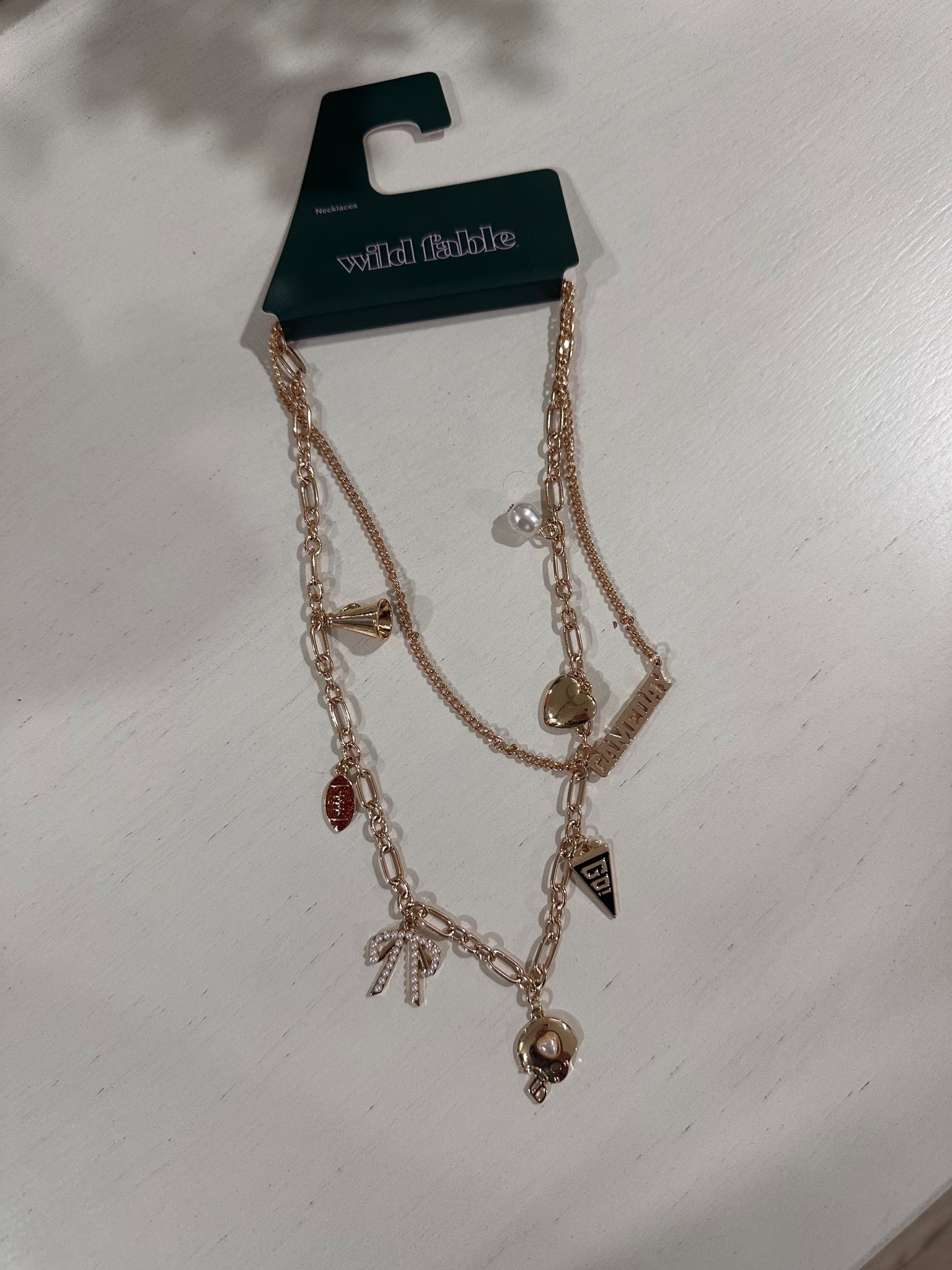 Cutest game day necklace // only $10 // Target finds // football season // go sports 

#LTKStyleTip #LTKFindsUnder50 #LTKFamily