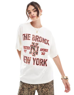 ASOS DESIGN oversized t-shirt with nyc bronx graphic in cream | ASOS (Global)
