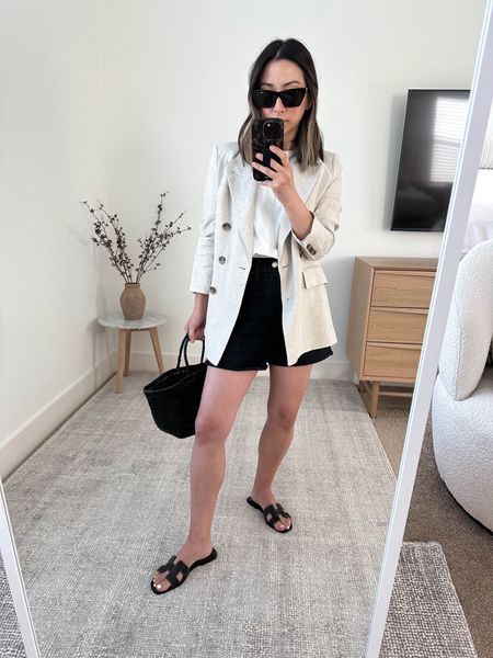 Banana Republic linen blazer. On sale! This blazer is amazing. Sized up for an oversized fit.  Agolde Dee shorts in black. Size up 2 sizes. 

Banana Republic linen blazer petite 2
Everlane Tee Medium
Agolde Dee shorts. 26
Hermes sandals 35
Dragon Diffusion tote 
YSL sunglasses. 

Sandals, jean shorts, petite style, summer style, vacation outfit. 

#LTKshoecrush #LTKsalealert #LTKitbag