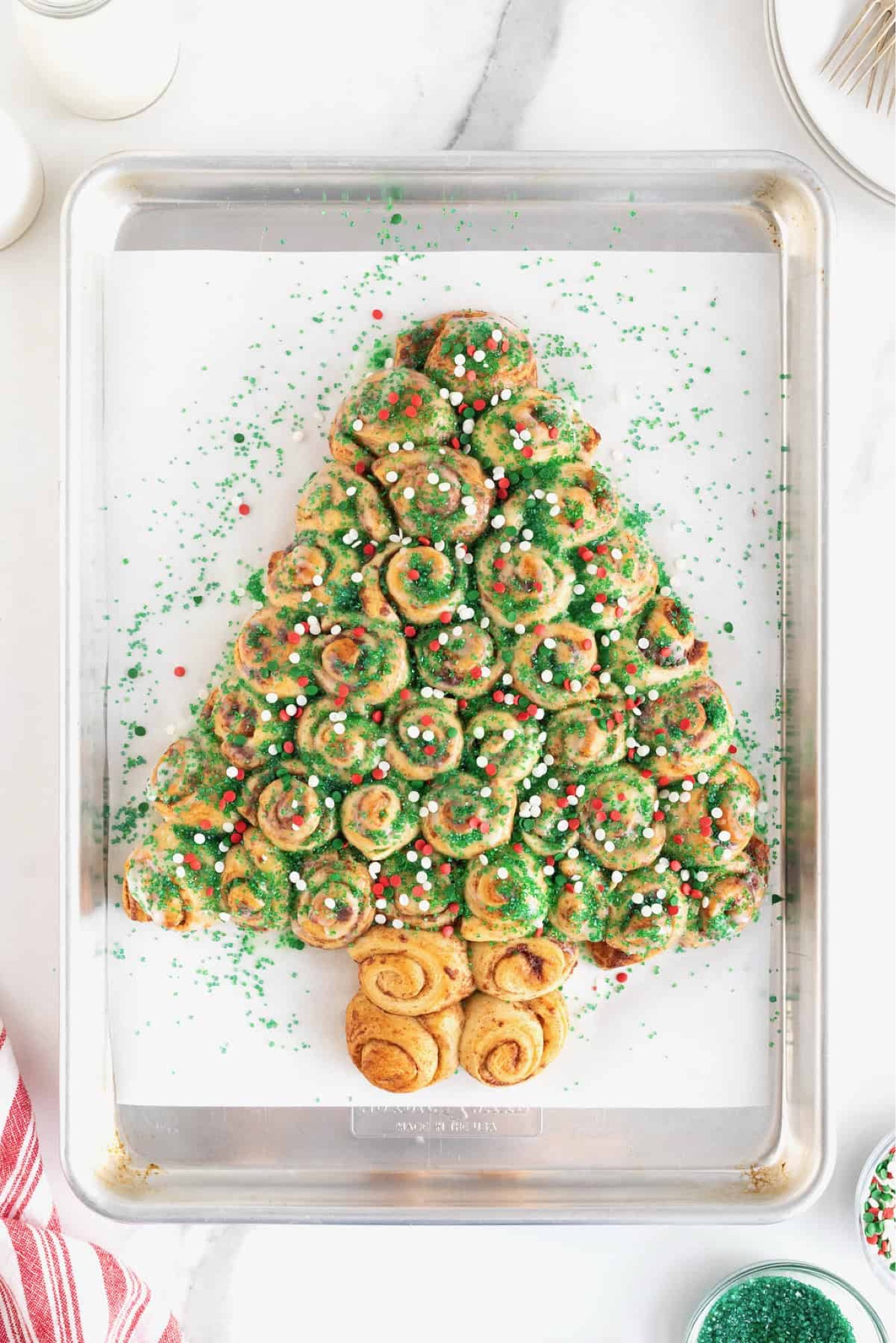 Make a magical morning even sweeter! Made with canned cinnamon rolls and holiday sprinkles, this delicious Christmas Tree Cinnamon Roll Pull-Apart is easy, festive and fun!

#LTKHoliday #LTKSeasonal