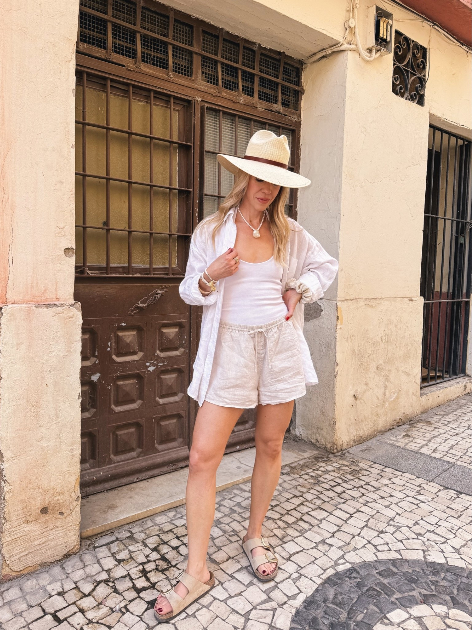Summer vacation, European summer, linen shorts, seashell necklace, @Janessa Leone straw hat, beach vacation outfit

#LTKTravel #LTKOver40 #LTKSeasonal