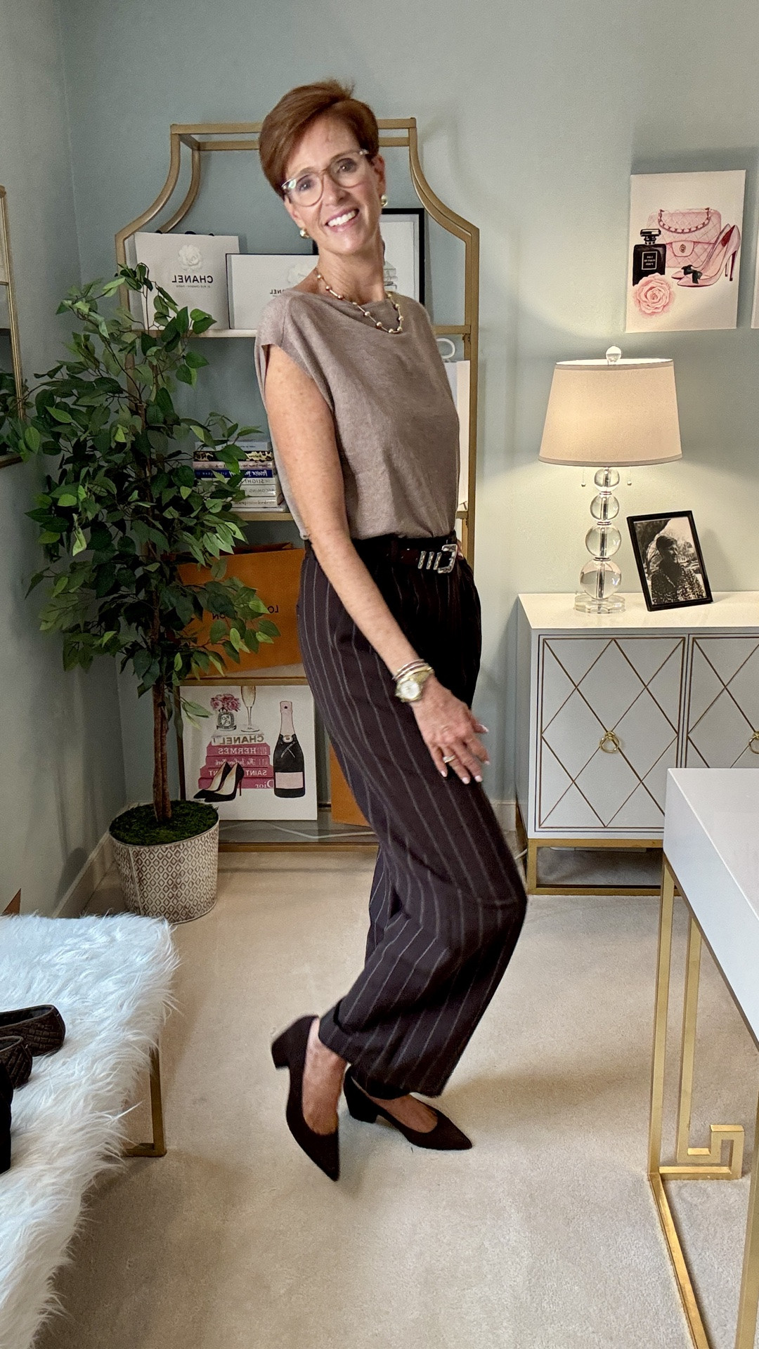 Fall trousers don't have to mean “office clothes.”

OUTFIT 007 is proof that one great pair of chocolate brown pinstripe trousers can make getting dressed for fall surprisingly easy.

I paired them with a light brown boatneck sweater shell, a brown suede belt and pointed-toe block heels for a tonal brown outfit that feels polished without feeling overly dressed. And that's exactly what I'm looking for in a great pair of fall trousers: something I can dress up for work but still style for real life.

This week we're talking ALL things fall trousers, and I'll be showing you just how versatile they can be.

Save this outfit for the next morning you don't know what to wear, send it to a friend who loves classic fall style, and tell me below:

Are you wearing trousers mostly for WORK or WEEKENDS?

#FallTrousers #ClassicStyleOver50 #Over50Style #TallStyle

#LTKootd #LTKOver40 #LTKTall