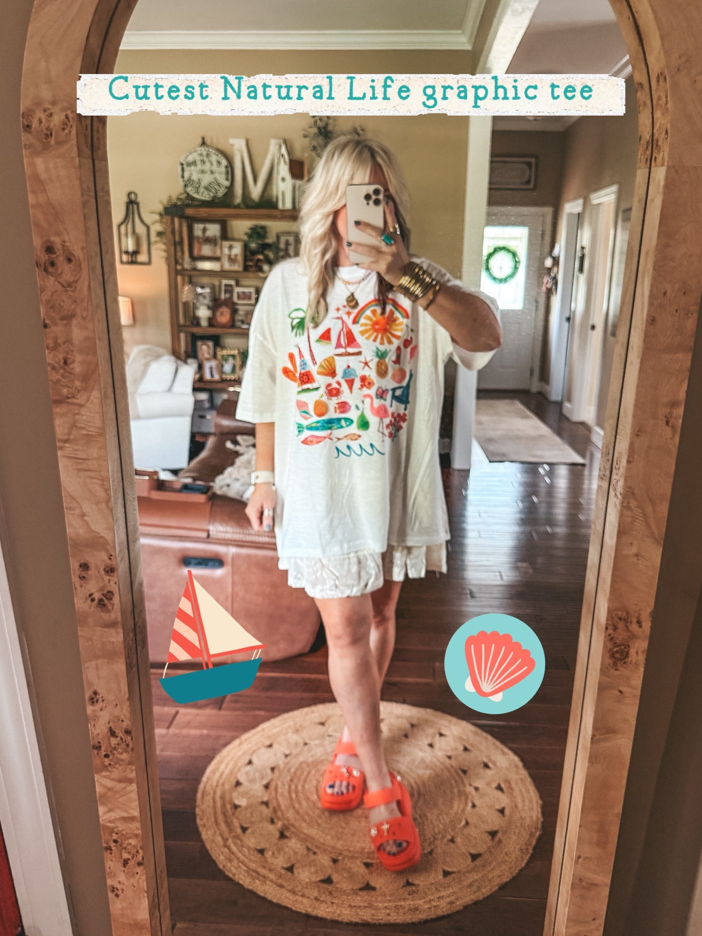 This tee is SO CUTE!! I did size up but it’s already oversized. I could’ve stayed true to size. This is a large. 
•My skirt is a medium 
•Crocs I size down one. 
@Natural Life #naturallife #summeroutfit

#LTKOver40