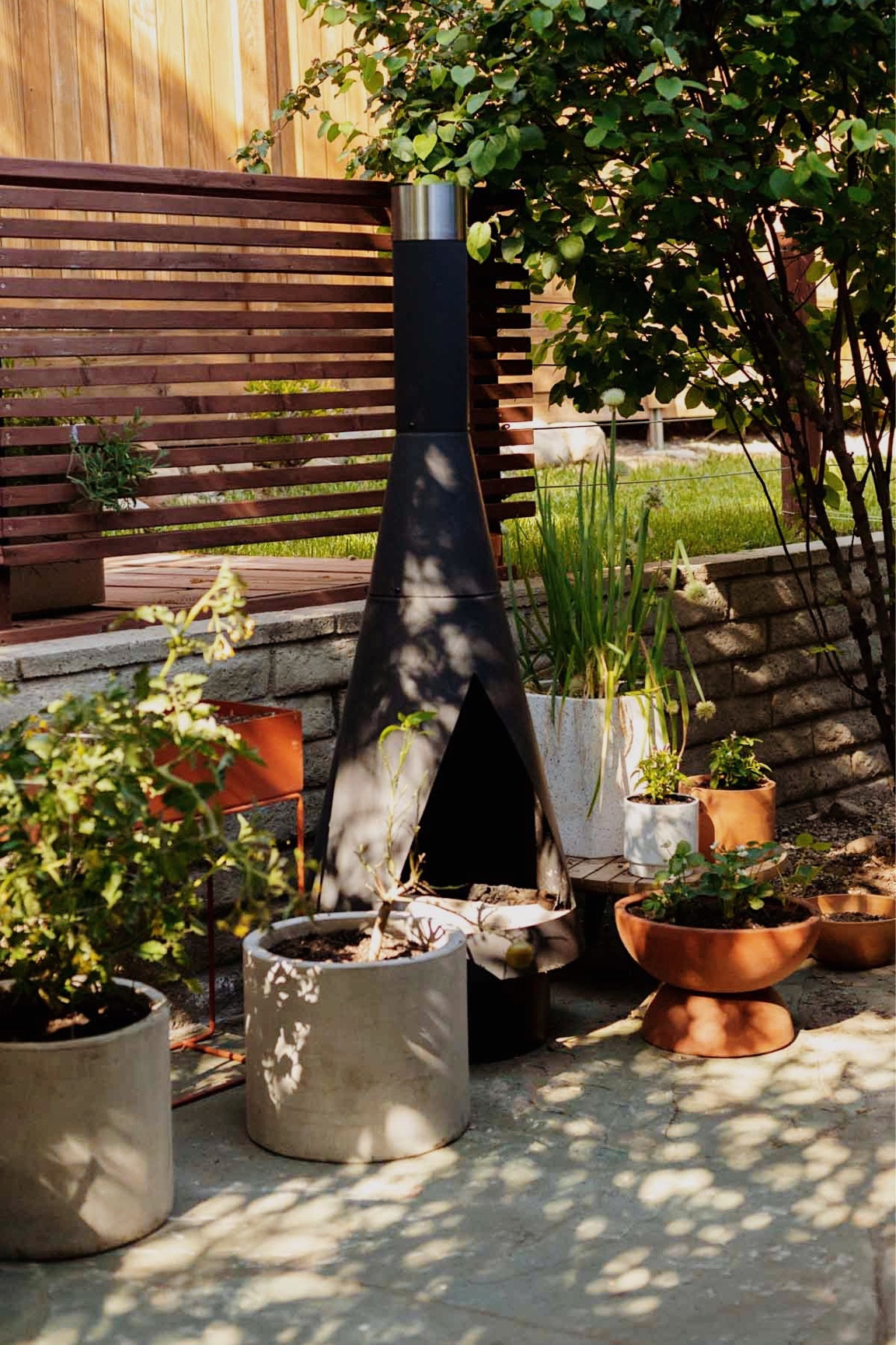 Outdoor living - gardening - plants - planters - outdoor chiminea - container garden

#LTKFind #LTKhome #LTKstyletip