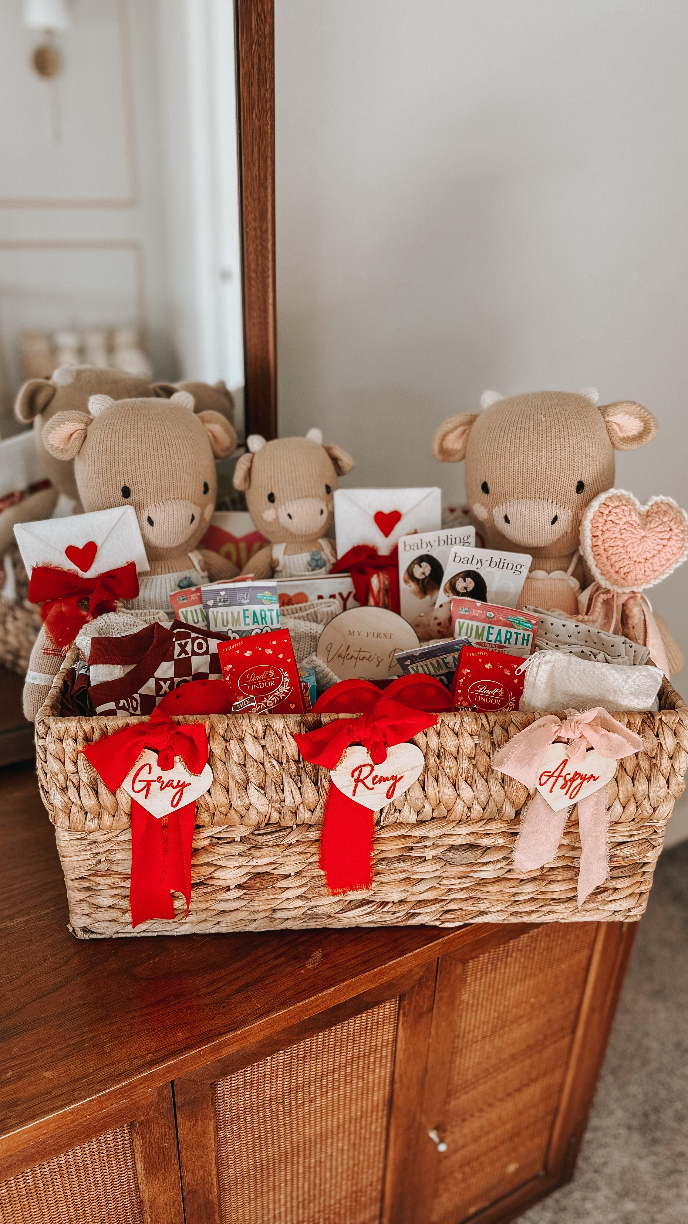 grayson, aspyn, + remington’s love baskets💌 added in some new with old and i’m so excited to give these to them tomorrow!😍 #lovebaskets 

-knit dolls: @cuddleandkind (discount link in bio) 
-books: @amazon 
-love wands, name tags, love board: @marigoldmamamade (code ‘occurringwitholivia’
-bow clips: @babybling 
-sweaters: @wyldeaspyn (code ‘occurringwitholivia’ 
-pajamas: @lovedbaby (code ‘olivia20) and @shoptinytrendsco 
-embroidered onesies: @lupinelittles (code ‘occurringwitholivia’)
-toys: @target and @cocovillage (link in bio)
-treats: @target 

#valentinesday #vday #letthembelittle #littlepiecesofchildhood #cocovillage #cuddleandkind #lovedbaby #valentinesdaycrafts #toddlercrafts #babycrafts