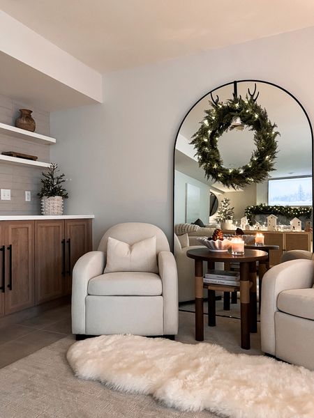 The curries t sitting area all
Decked out for the holidays with the citrusy set of sitting chairs,
Round side Table and arched floor mirror ! 

#LTKsalealert #LTKstyletip #LTKhome