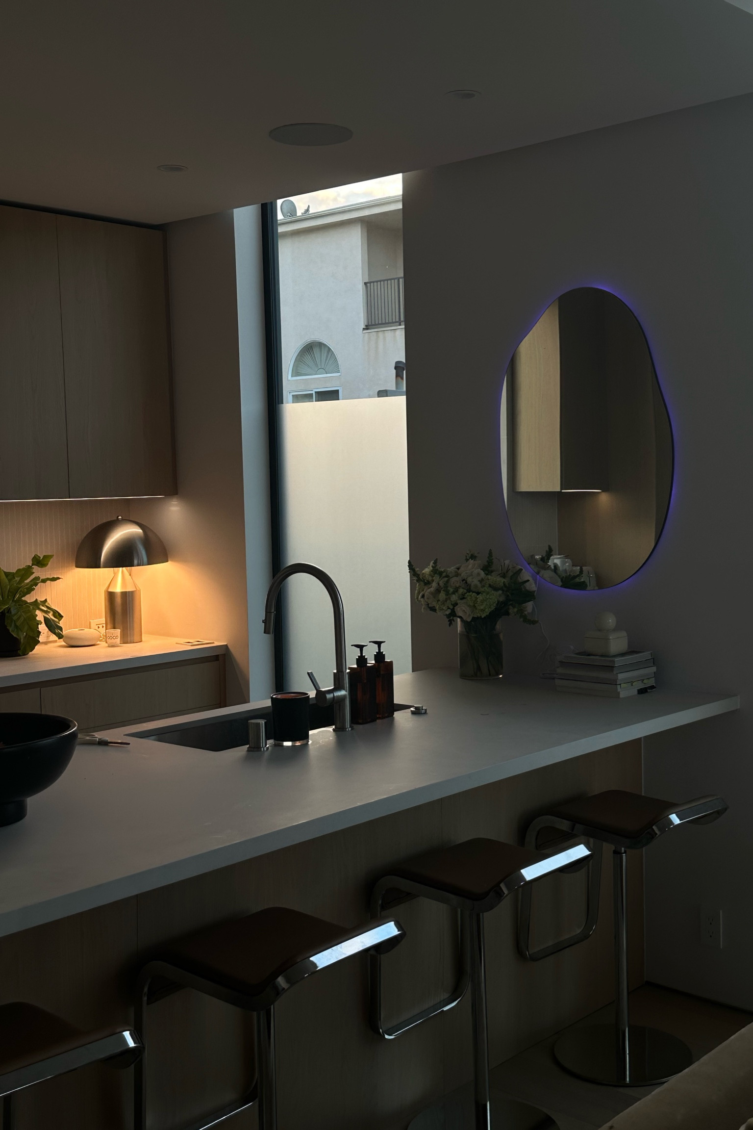 I love my kitchen so much. I added a strip light to the back of this mirror to add a touch of moody ambient lighting. It changes any color & can connect to your phone.  I put potpourri in the terracotta decorative bowl. The pedestal bowl from Pottery barn, mushroom lamp, vase, canister, soap pumps etc are also linked! Fall interior design is my weakness right now. 

#LTKhome #LTKSeasonal #LTKHalloween