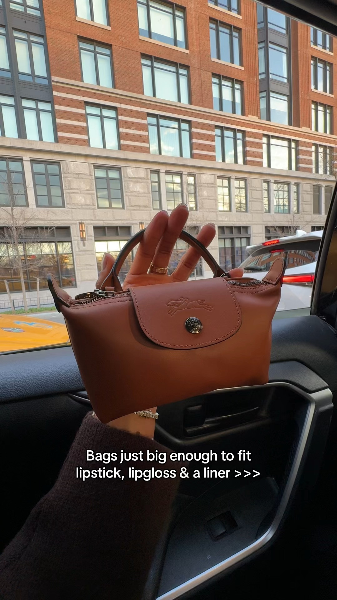 What do we think about this mini leather pouch? Personally, I love a micro bag that can fit just my lip combo of the day. This one form longchamp is so cute and petite - you can also stash it in your bigger handbag! … For more links to spring outfits 2026, easter dress women, easter outfits women, date night outfits, vacation outfits beach, spring dresses, easter basket ideas, work outfits, country concert outfits, follow me on LTK! ✨

#LTKootd #LTKspringtrends #LTKspring