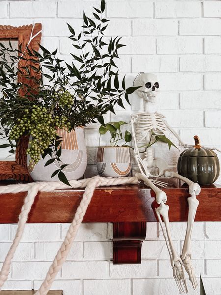 Skeleton friends are out to play. #mantel decorations #mantledecorations #skeletondecorations #walmartfinds #halloweendecor #simpledecor #ltkunder20

#LTKhome #LTKSeasonal #LTKHalloween