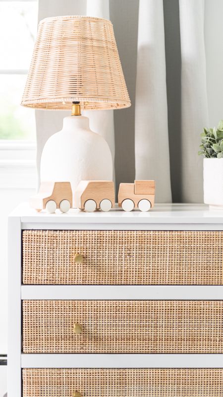 White and wicker nursery furniture and home decor, dresser, lamp, wooden toy, coastal style home decor

#LTKhome #LTKfamily #LTKbaby