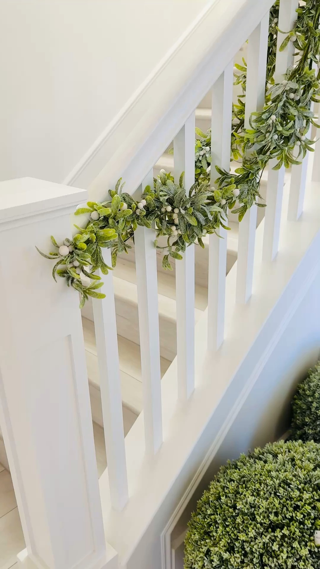 Decorating my banister with this gorgeous 1st layer of frosted green garland with white berries. I’m using 2 garlands wrapped around one another on each side of the railing for a fuller look. 🎄🌿
I tie the garland to the banister using the clear stretchy ties. I’ll then use some of the matching picks to cover the stretchy ties. I also like to add a 2” double sided gold satin ribbon once finished if I want something more  

#LTKSeasonal #LTKHoliday #LTKFindsUnder50