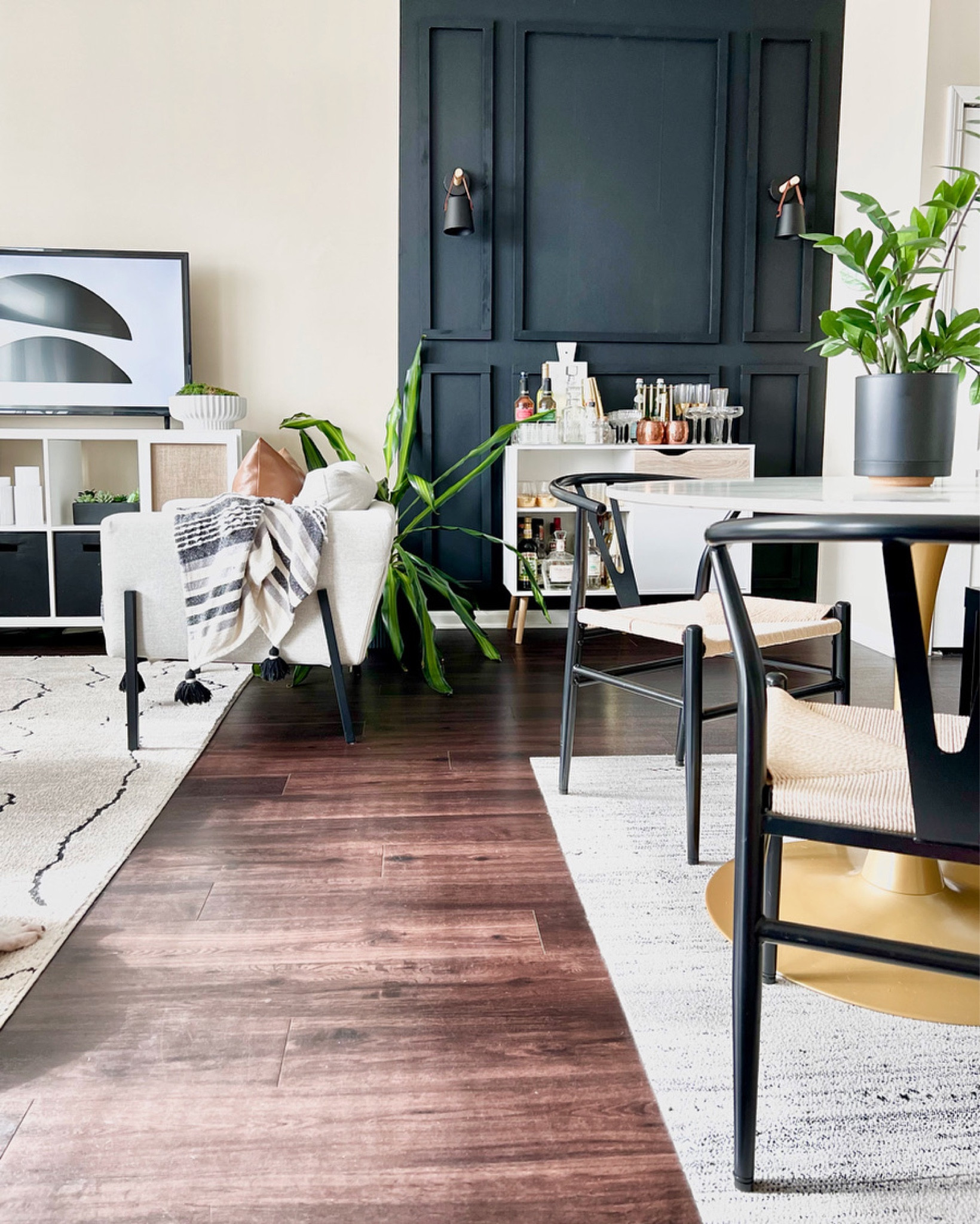 My absolute favorite view of my dining room and living room.

The contrast from the black wallpaper and diy paneling against the light walls is stunning!

My favorite feature has to be the wishbone chairs!

#LTKsalealert #LTKhome #LTKfindsunder100