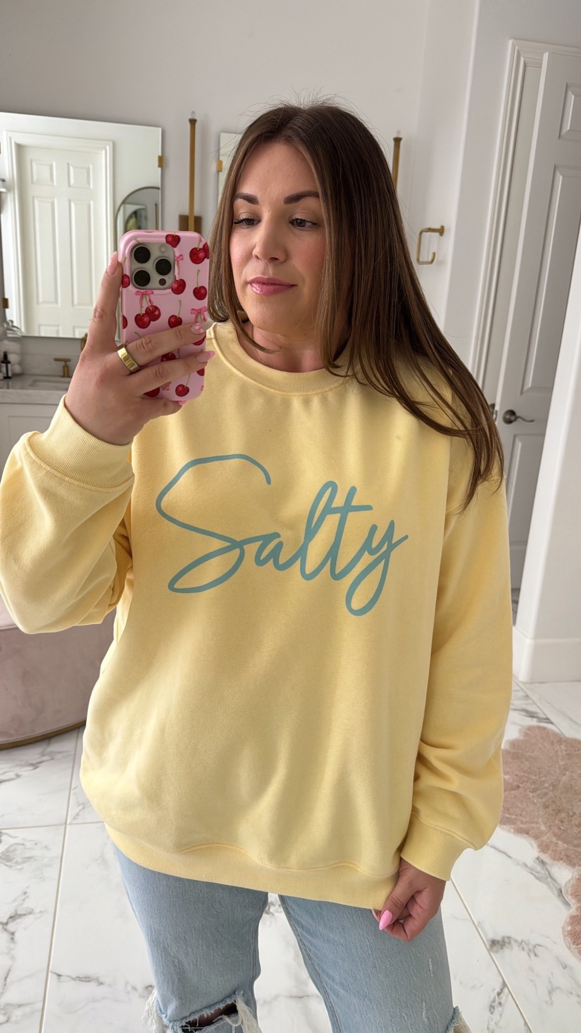 curvy midsize spring outfit! wearing size xl in salty yellow sweatshirt for an oversized fit and size 31 in denim 

#LTKMidsize #LTKSpringSale #LTKFindsUnder100