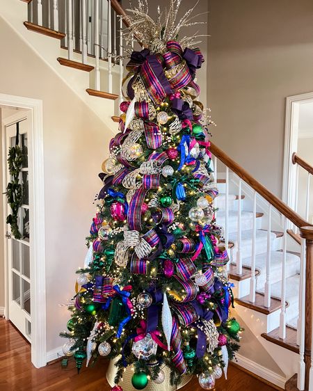 Colorful jewel tone Christmas tree with gems, lots of sparkle ribbon, and iridescent accents. 

Christmas tree | Christmas decor | holiday decorations | tree design 

#LTKhome #LTKHoliday #LTKSeasonal