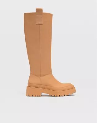 Stradivarius chunky sole high leg boots with side tab in brown | ASOS (Global)