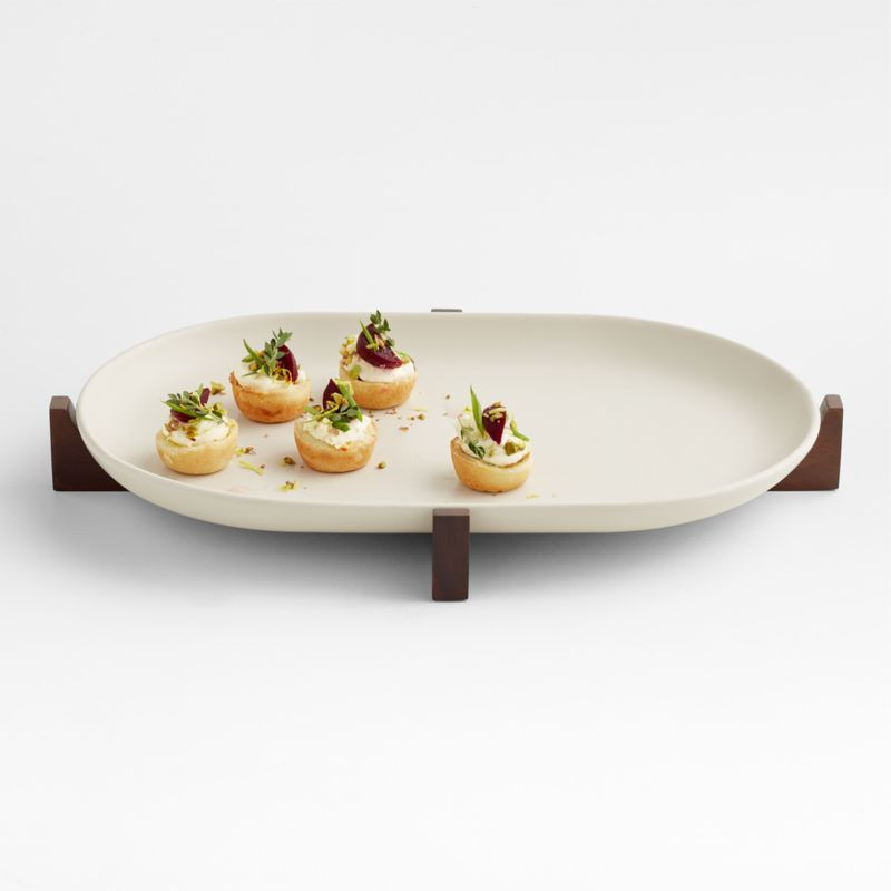 Oven-to-Table Oval Platter with Dark Wood Trivet + Reviews | Crate & Barrel | Crate & Barrel
