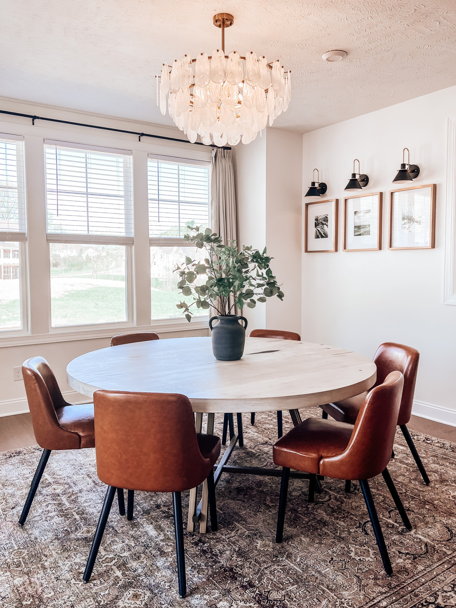 Life is all about balance, I like to mix high end pieces and a great deal. Knowing your personal home style is the key. We paired an Arhaus table and then chairs from amazon. The chairs are a great quality and with kids, leather is the way to go. #homestyle #breakfastnook #diningroom #lighting #diningtable #breakfasttable 

#LTKhome #LTKfamily #LTKstyletip