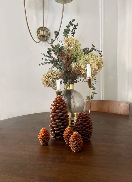 Thanksgiving table decor- pinecone candles, gilded glass vase,  gold candlesticks 

#LTKHoliday #LTKCyberweek #LTKSeasonal