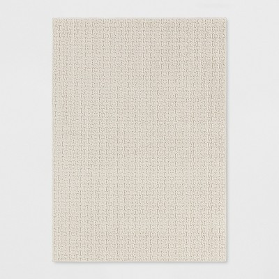 5'X7' Washable Solid Machine Tufted Area Rug Tan - Threshold™ | Target