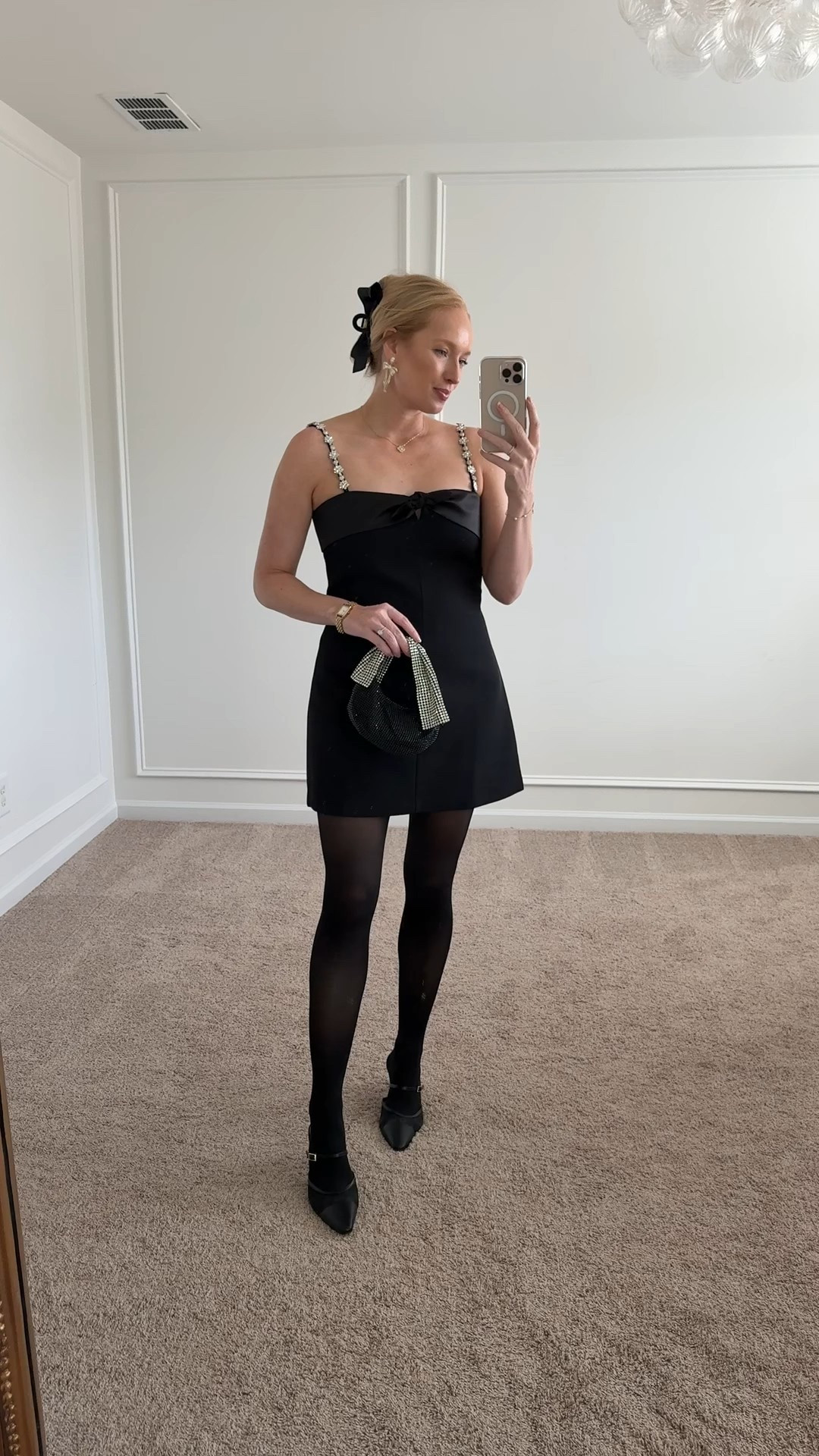 Love this black satin mini dress for the holidays. Wearing a small here! 
