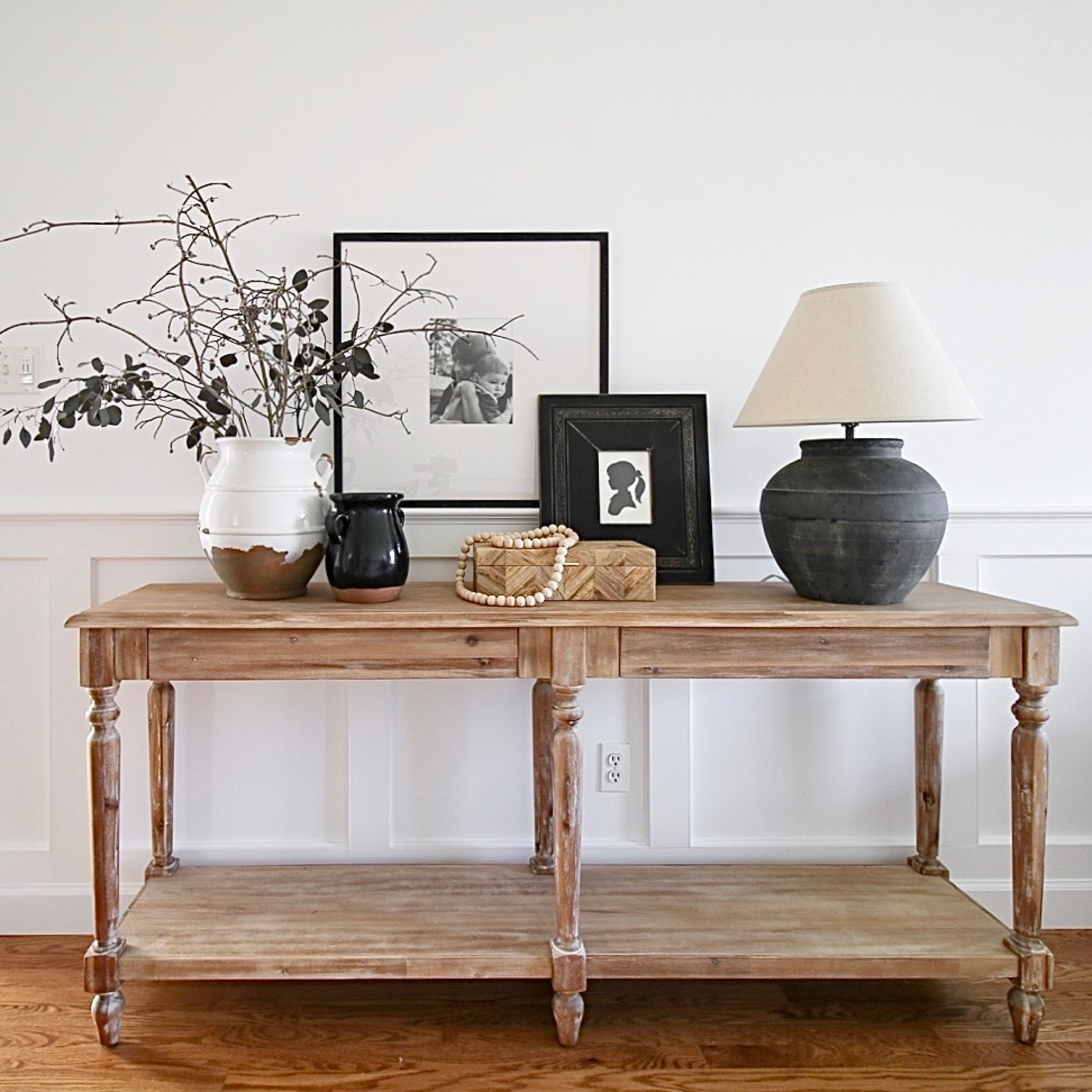 One of the things I love about my house is the loft area above my entryway. Instead of a grand entryway, the uniform ceiling on the first floor allows for a  full loft area. 
This is the area at the beginning of the landing. Originally I had the Everett weathered natural wood console table in the space. It is topped with a ceramic table lamp and wood gallery frame from Pottery Barn 

#LTKstyletip #LTKFind #LTKhome