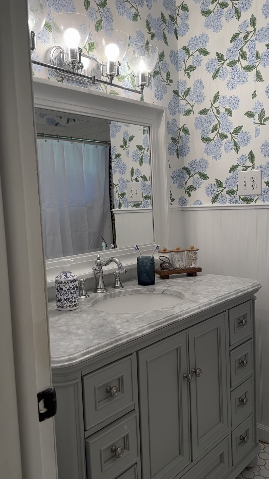 Coastal grandmother bathroom makeover!! We are IN LOVE with the new powder blue and hydrangea themed bathroom! 

#LTKhome