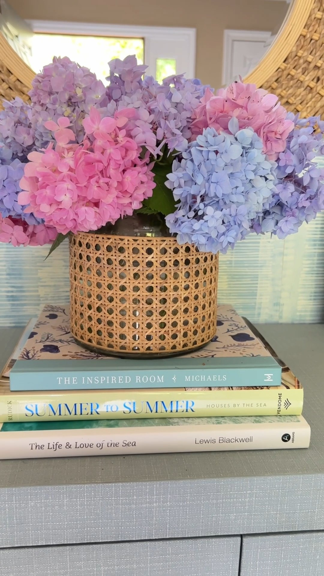 This cane-wrapped vase is perfect for spring and summer flowers and adds natural texture to any shelf styling moment. I love how it brings coastal warmth and effortless designer-inspired style to bookshelves, consoles, and tables. 

#LTKSaleAlert #LTKHome #LTKU