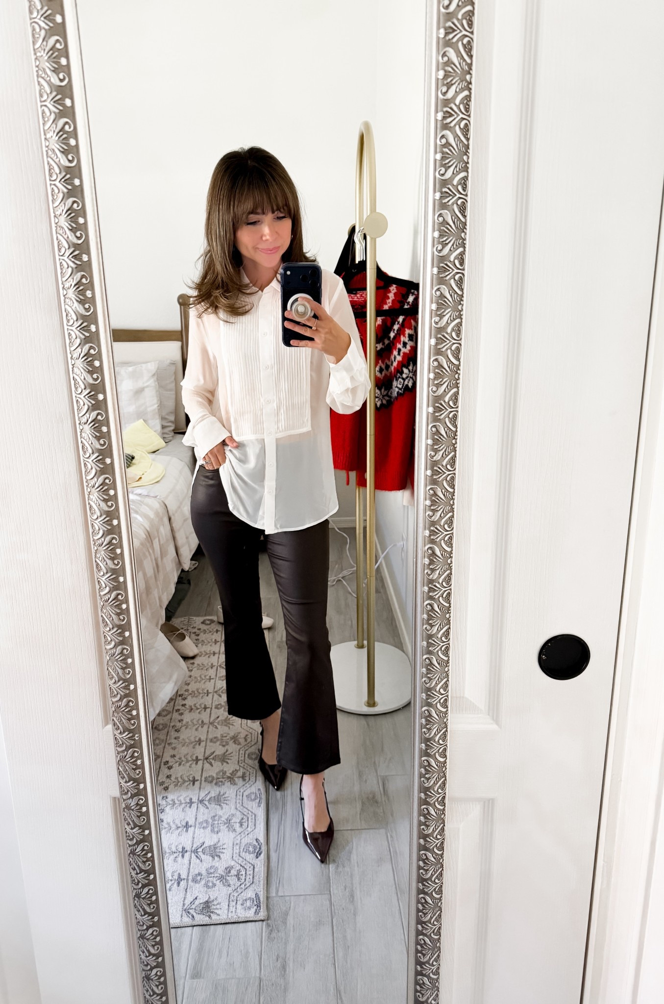 This is one of those outfits that instantly makes you feel pulled together. A sheer white blouse paired with sleek black flare pants is timeless, flattering, and easy to repeat for dinners, meetings, or holiday events. I love how this silhouette works for petites without feeling too dressy or too casual.

Top XS 
Pants petite 25



#LTKPetite #LTKHoliday