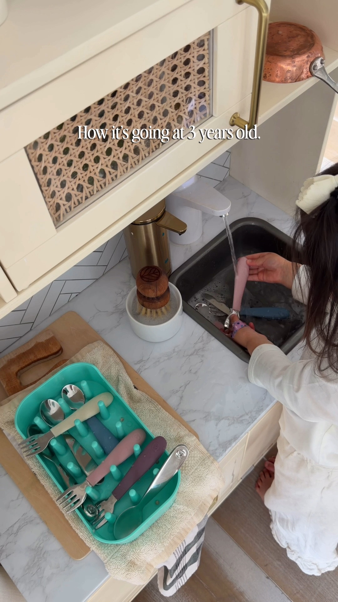 Montessori inspired kitchen for a toddler! Here is what we used to transform this IKEA kitchen into a functional kitchen so she would have running water and learn she’s capable. We used a really thick and durable peel and stick tile that is made of actual stone, but would recommend a more gel-like one instead. I swapped the fake cooktop for a cutting board I found on Etsy. All other items are linked on my Amazon storefront in the INDEPENDENT KITCHEN folder!