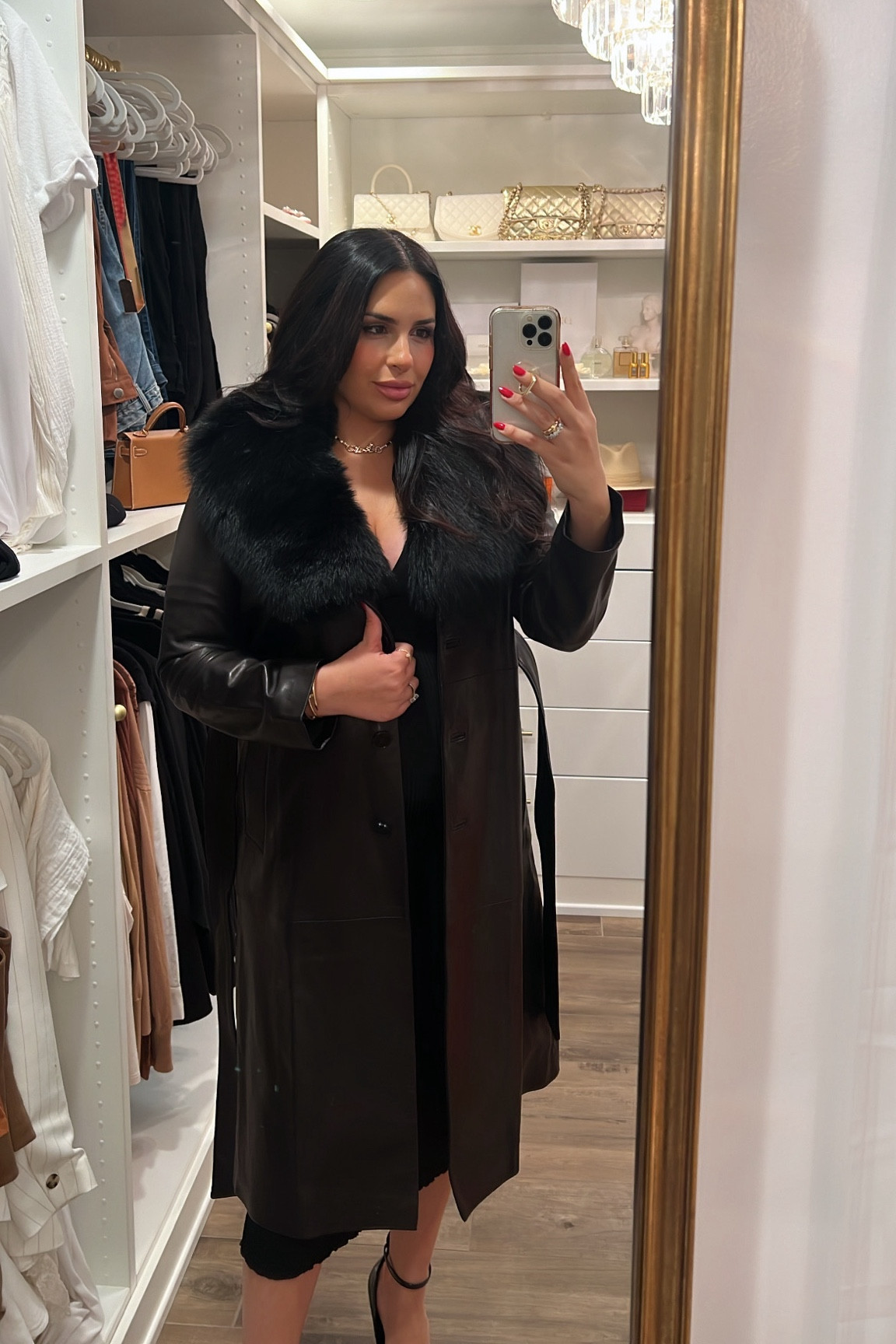 Black leather trench coat with fur collar 

#LTKSeasonal #LTKCyberWeek #LTKHoliday
