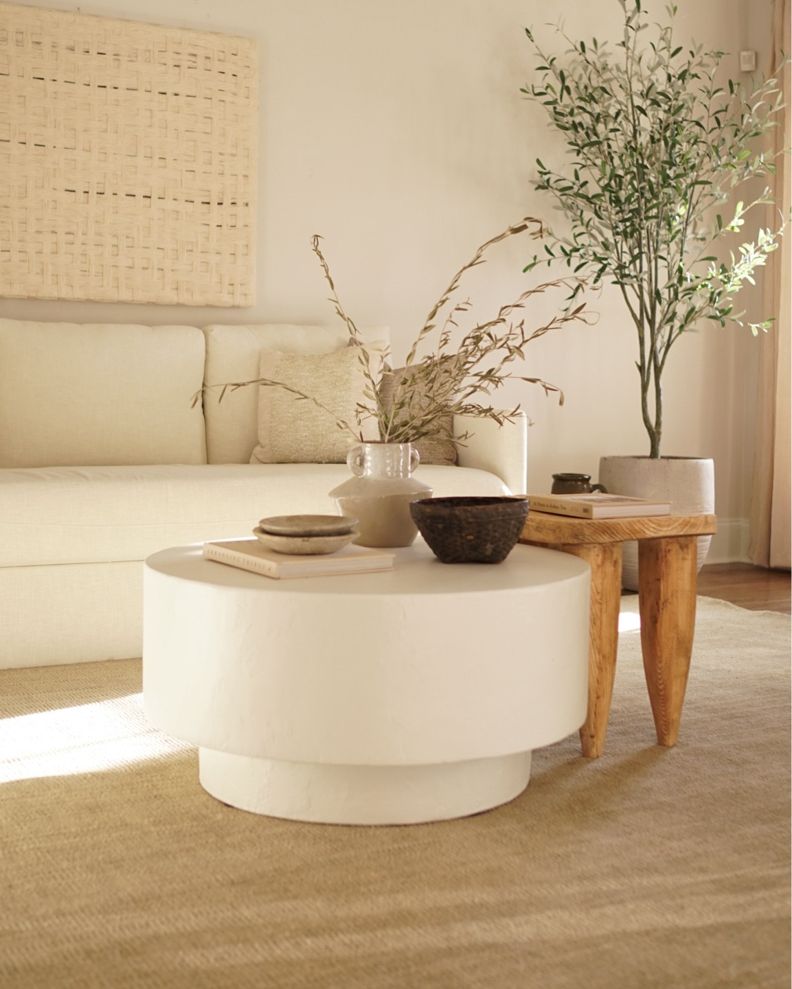 Organic & earthy living room design

plaster coffee table- Senufo stool- wool Rug- table styling - textured wall art - neutral rugs- art - olive tree - earthy design 

#LTKfindsunder100 #LTKstyletip #LTKhome