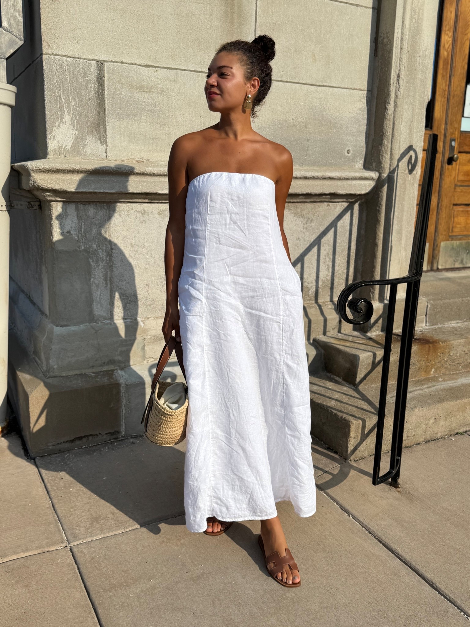 strapless dress, brown leather sandals, straw bag, and gold accessories 

#LTKStyleTip #LTKSeasonal