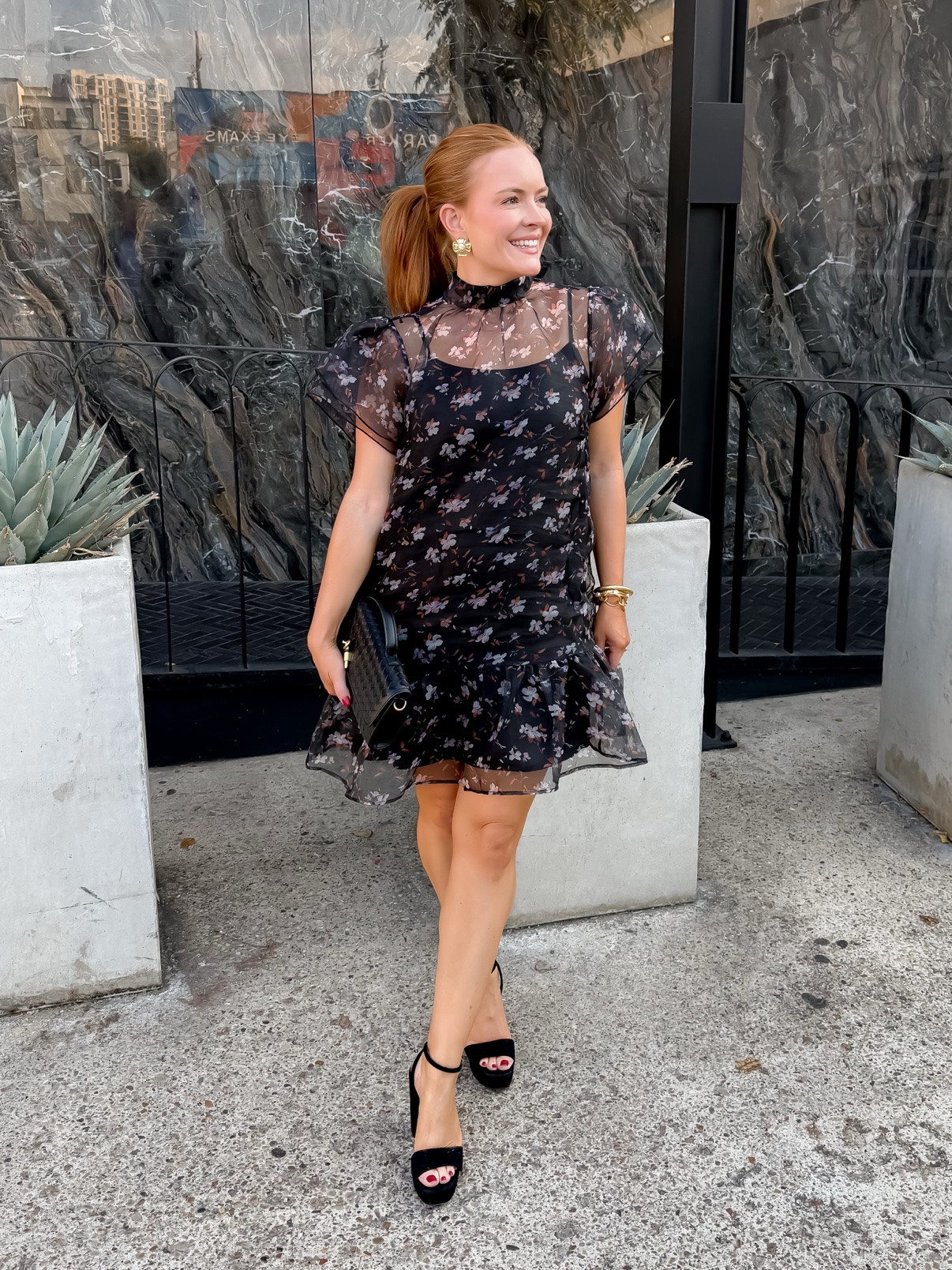 Wearing small in the dress
Black floral organza mini dress with sheer puff sleeves — the perfect fall wedding guest dress or date night outfit. Flowy, feminine, and so flattering. Shop the dress, clutch and heels here.
#weddingguestdress #fallwedding #blackdress #datenightoutfit #minidress #falldresses #cocktaildress #partydress