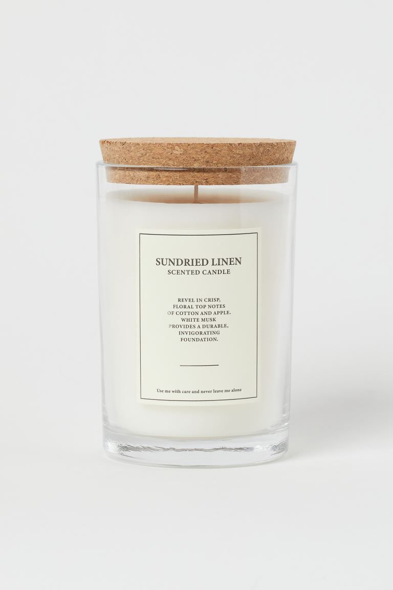 Large scented candle in a glass holder with a cork lid. Diameter 3 1/4 in. Height 6 in. Burn time... | H&M (US + CA)