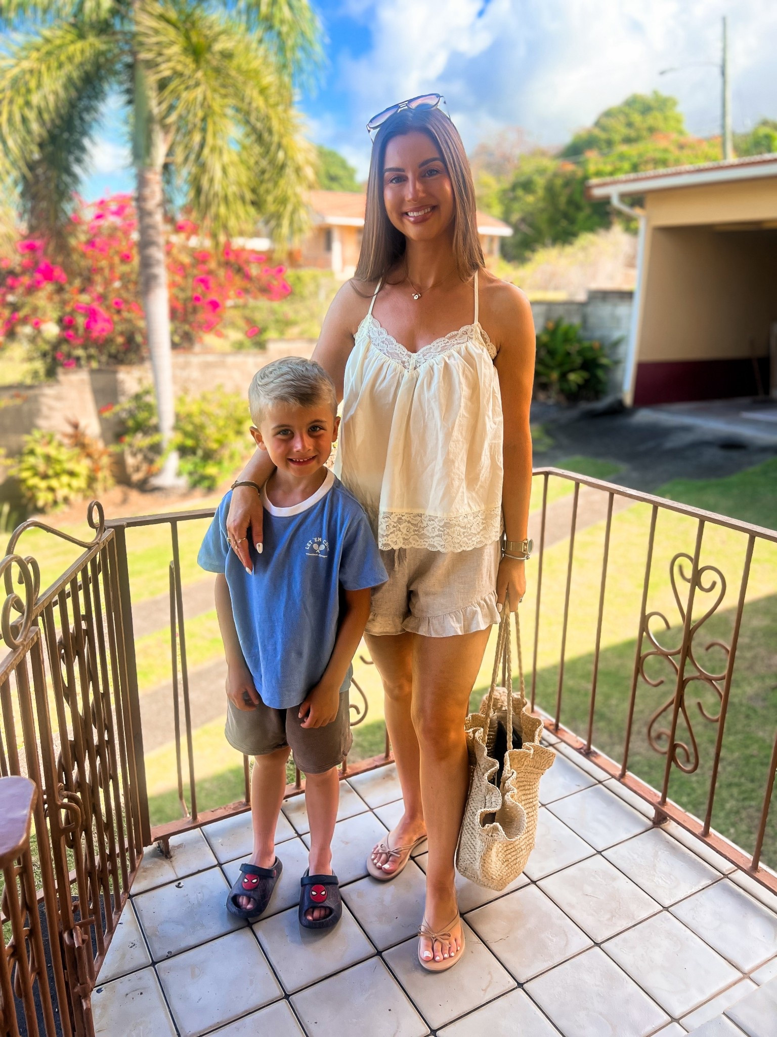 Yellow lace flowly tank top-small
Linen ruffle shorts-small
Beige tan bow flip flops
Ruffle rattan bag 
