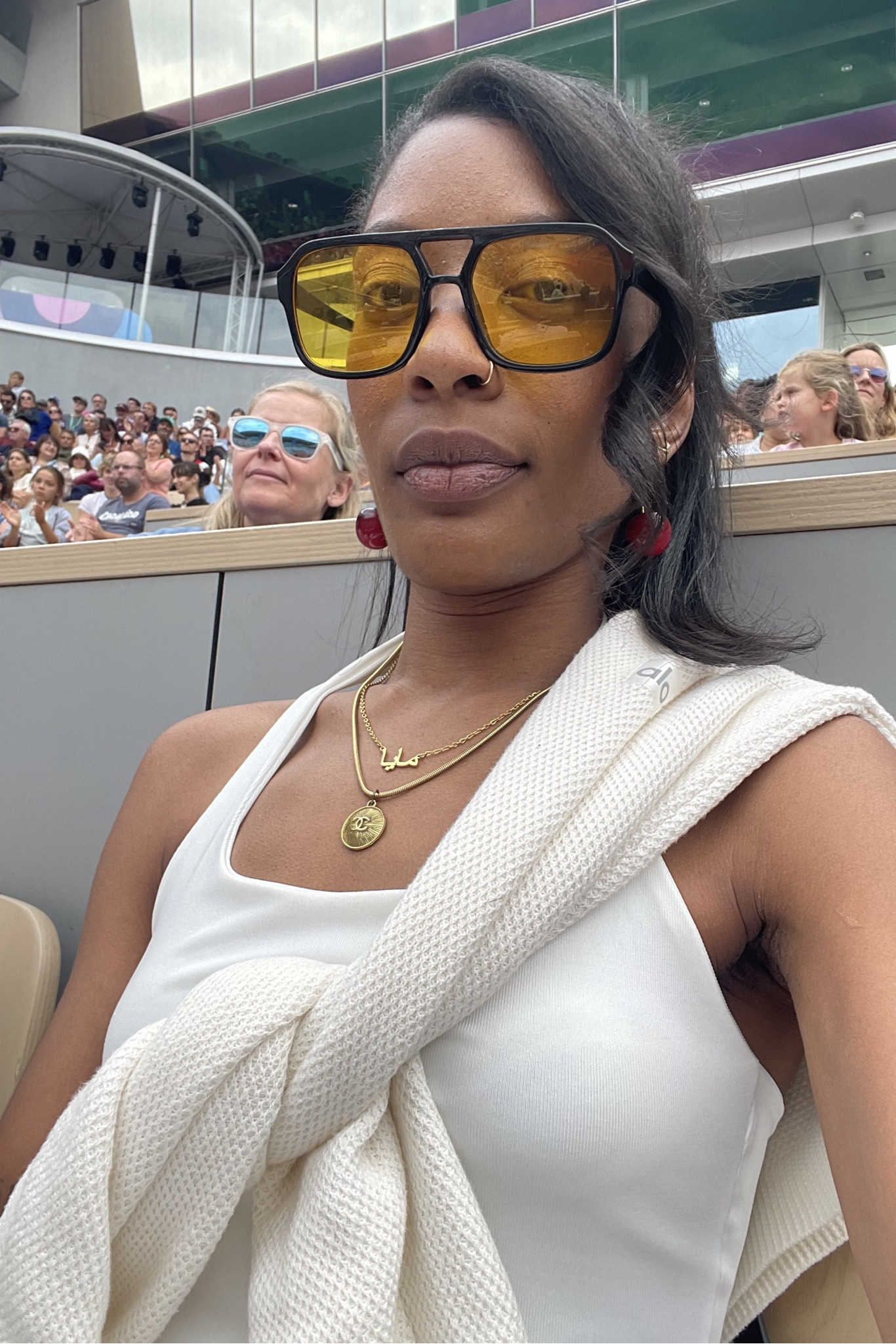 Loved this tennis white outfit for the Olympics, wore it again for other athletic events and it’s comfy and so cute! The glasses & earrings were the pop of color I needed. 

✨Glasses - yellow retro glasses from temu
✨Earrings - Cherry drop earrings from temu 
✨Necklaces - Arabic name necklace, reworked Chanel necklace from Reluxe Vintage (similar linked but sorry its so expensive I can’t link my exact one)
✨Top - Forever 21 white halter 
✨Sweater - Alo Tennis Club Sweater Knit V-Neck Pullover 

#LTKTravel #LTKFindsUnder100 #LTKStyleTip