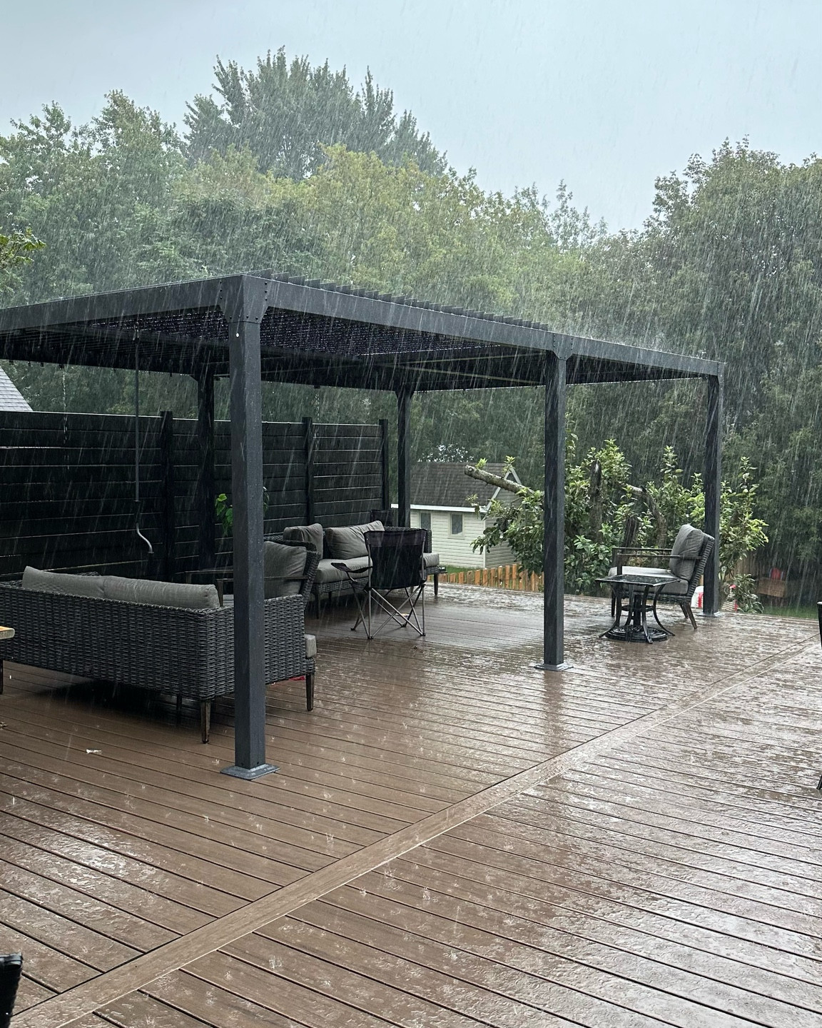 Madly in love with my best purchase of the year, this louvered pergola. This picture is perfect proof...closing the louvres keeps the rain out perfectly! (And your kids leaving a section open gets that area wet 🤦🏻‍♀️) linked to both US and Canada locations!

#LTKStyleTip #LTKSeasonal #LTKHome