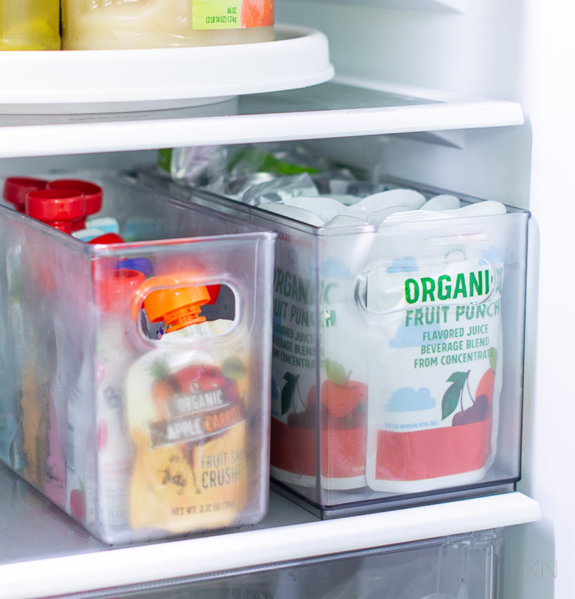 I have several of these narrow bins in my refrigerator to corral juice and fruit pouches. Another organization hero is the turn table that holds sauces and condiments. home organization kitchen organization refrigerator organization refrigerator storage kitchen storagee#LTKStyleTip 

#LTKFindsUnder50 #LTKHome