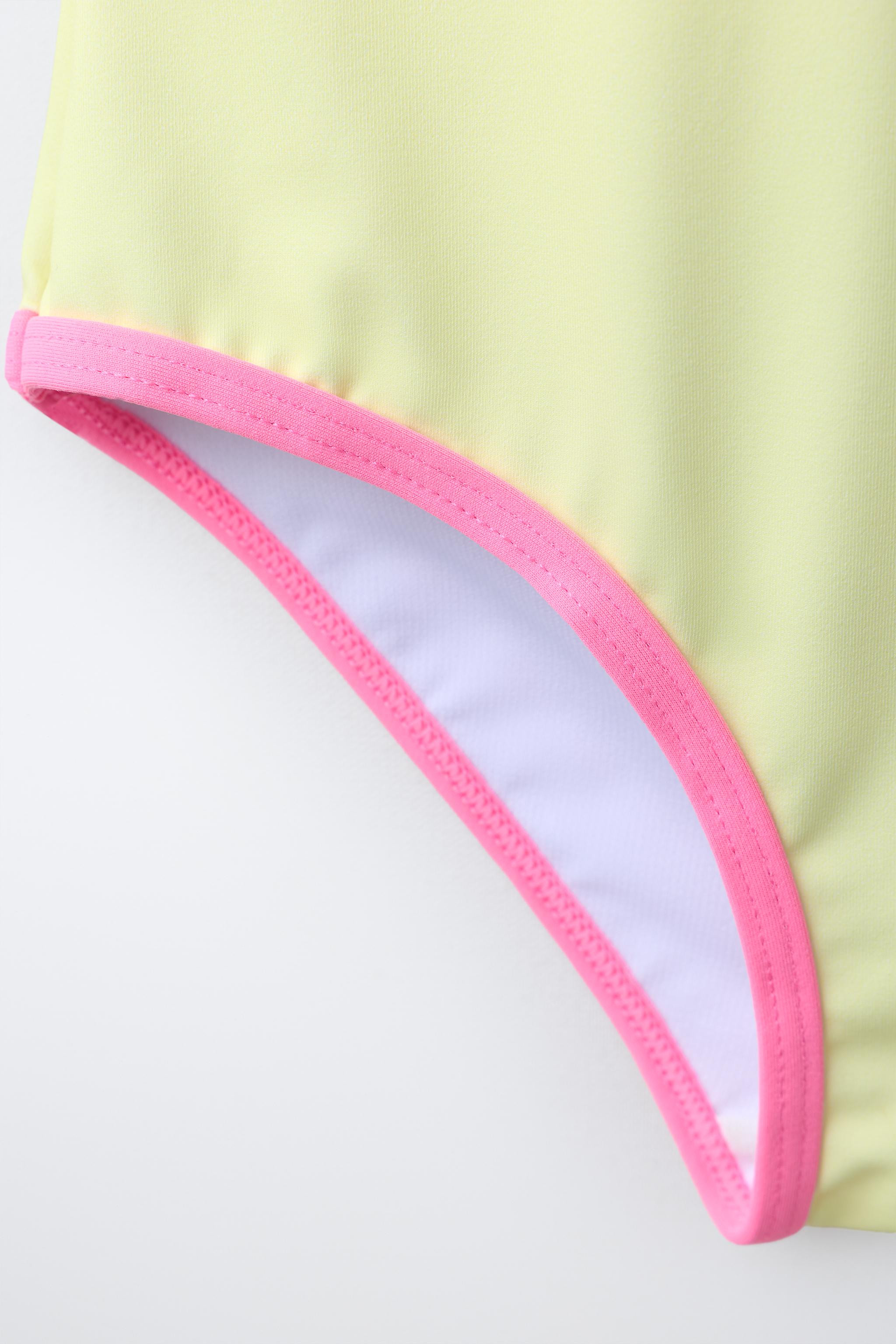 Swimsuit with a round neck and straps. Hibiscus flower print. Contrast color trim detail. | Zara US