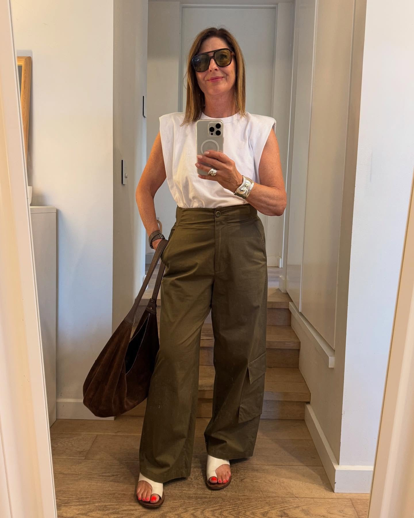 Can you wear a chocolate brown suede bag in summer ?
Of course you can !

I snapped up this fabulous suede bag about a year ago when I first sniffed out the trend of chocolate brown suede. …good news : it’s now back in stock ! 

I needed a bag to take on my trip to Paris & Provence last May & as soon as I saw this one I knew it was perfect for my trip. And it was !
I also knew I needed a bag to wear all winter , into this summer and now of course this coming season .

What’s to love ? 
The colour of course : the chicest chocolate brown. It works with everything in my wardrobe… summer to winter 👉Swipe 

The shape: casual yet chic great for every day.
Slouchy shapes are so versatile because they look casual but the suede makes it sophisticated. 

The size : you can fit ALOT in there so it’s great for travel but also not too big for going out for dinner. The less you put in , the smaller it looks ! 

The strap : you can wear it across body as well as hanging from your shoulder. How much do we love hands free ?? Also wear it tucked under your arm.

The zip: it’s imperative for travel right ? You need a bag that zips up for security.

I love this bag so much I got it in black too! 

Tip: I sprayed it with waterproofing and brush every now and then to give it a joosh. 

I’m wearing : Frankie shop white tee @netaporter , khaki ( old) chinos @cosstores_au , white slides old @tonybianco 
 I’ve found so many chic choc brown suede bags from luxe to less : now shop my picks . So many good ones at all prices ! 

#shopwithfifi #ltkaustralia #fifireport #simplechic #chocbrownsuedebag #arket #luxetoless

#LTKstyletip #LTKaustralia