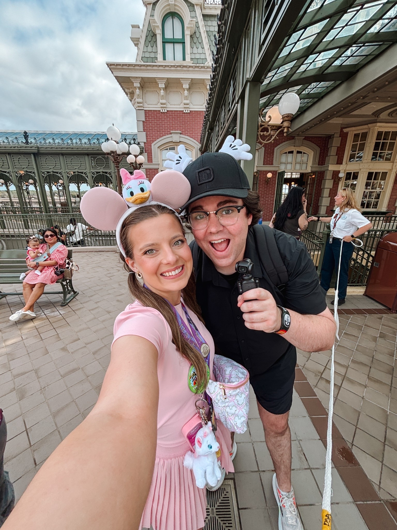 First step through the Magic Kingdom gates hits different every single time 🏰🩷 Wearing my favorite pink pleated skirt with the Daisy Duck ears and my Marie keychain fanny pack — all linked on my LTK!

#LTKvlog #LTKPetite #LTKTravel