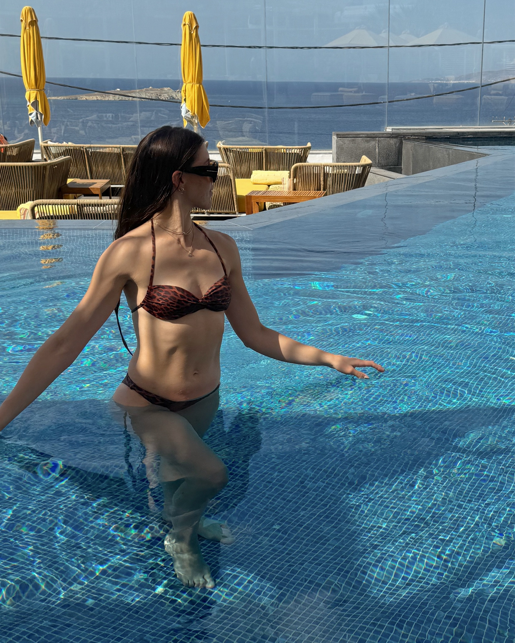 Leopard swimsuit ! High cut and cheeky , supportive top . Size small in both 