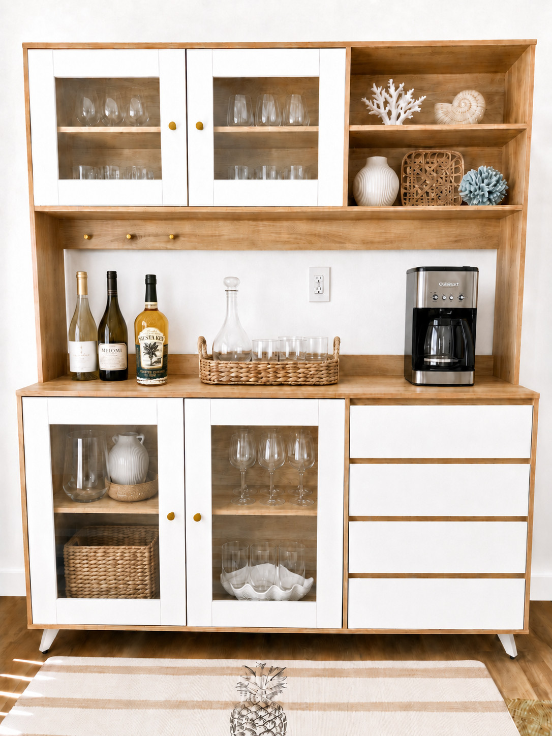 I needed a home for my coffee situation and my little bar — and I needed it off the counters. My beautiful quartz deserves better than a bunch of extra stuff covering it!
When I renovated the kitchen, there was a nook originally designed for a small table. But with a counter bar and a dining table already in the plan, another eating space made no sense — so I gave that nook a better job.
This beverage center fit the space perfectly, and then I did what I always do — I couldn't leave it as-is. The white doors got repainted to match my white cabinets exactly, and the black knobs got a gold spray paint upgrade to match my cabinet handles.
Because the best piece in a room is one that looks like it was always meant to be there.
Coffee and cocktails, all in one spot. Life is good. ☕🥂
🔗 Tap to shop — and seriously, don't skip the spray paint step - it's so easy and makes such an improvement. #beveragecenter #bar #cabinetbar #coffeestation #kitchenstorage #kitchenpantry #kitchennook 

 #LTKHome