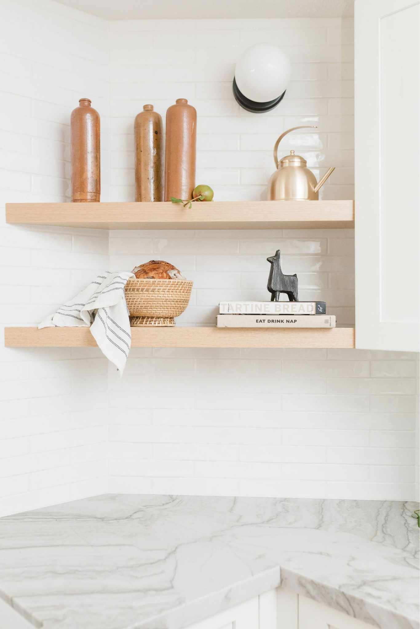 Kitchen shelf styling

Floating shelves, vintage oil bottle, woven basket, cook books, tea kettle, wall mounted sconce. 

Kitchen shelf styling, floating shelves, shelf decor, home finds, kitchen styling, kitchen decor, home decor. 

#LTKhome #LTKFind #LTKstyletip