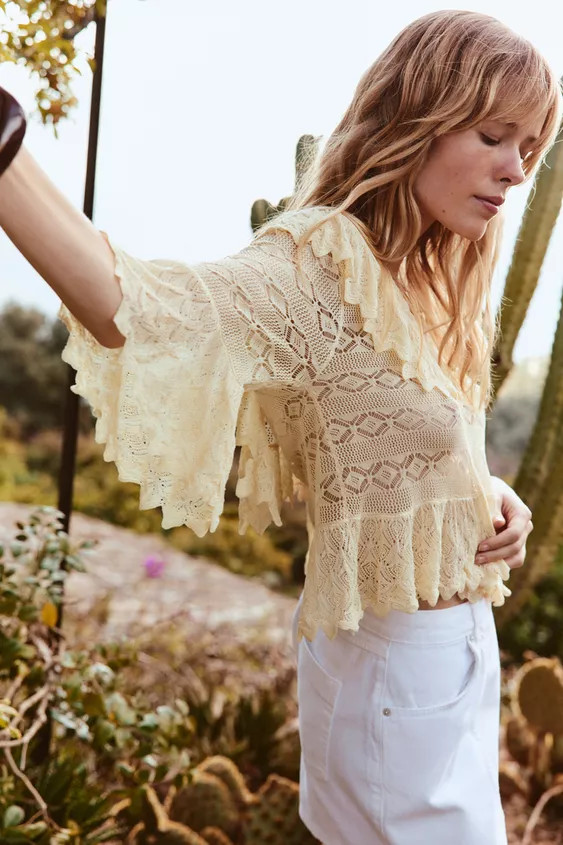 V-neck blouse with sleeves falling below the elbow. Ruffle trim detail. Button-up front. | Zara US