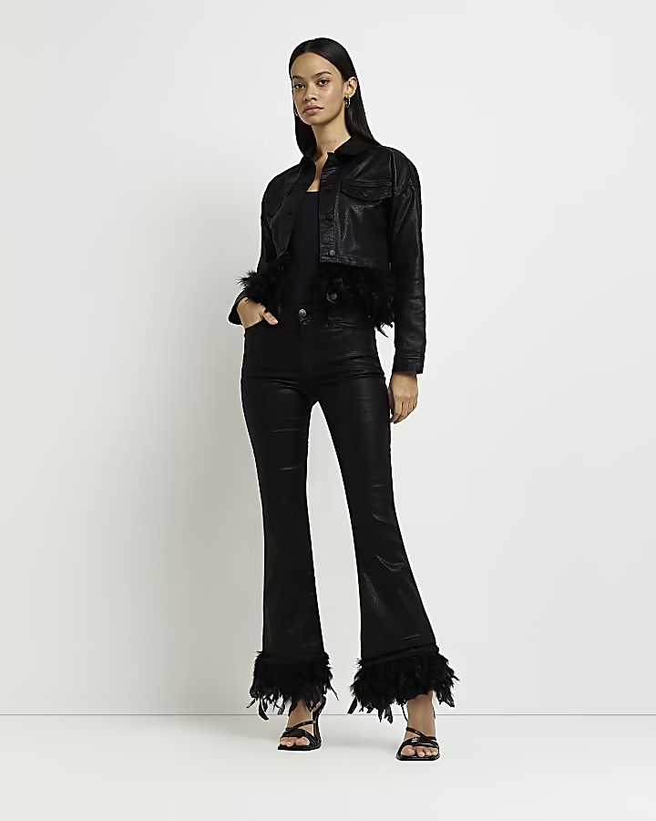 Black coated mid rise feather flared jeans | River Island (US)
