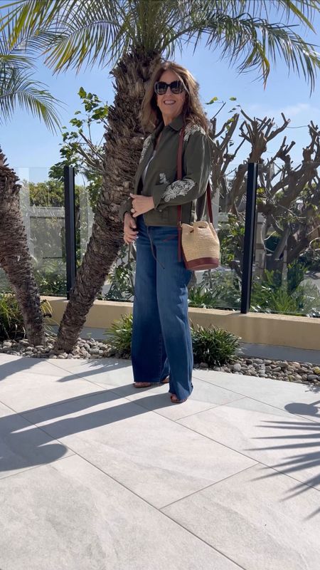 It's a gorgeous day in Dana Point, California, and I'm so happy I packed this utility jacket from Anthropologie. The embroidered details add something extra to the jacket that dresses up casual outfits. I'm wearing an xs, and it fits tts. 
The jeans are favorites that run big, so size down if you are between sizes. 
I’m wearing a small in the ClareV “oui” T-shirt.  
Plus, the Sam Edelman slide is a great and comfortable style. I just picked it up in black, too! 

#LTKSeasonal #LTKover40 #LTKSpringSale